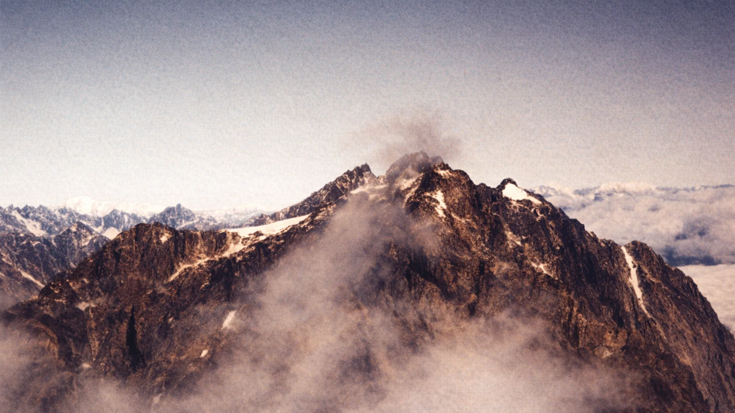A snow-dusted mountain peak